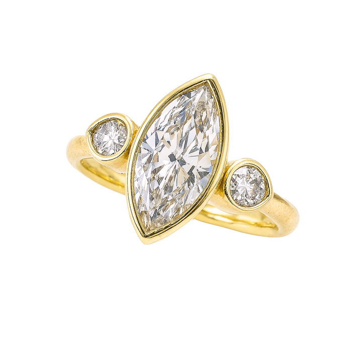 Front View of 1.5ct Marquise Lab Grown Diamond Engagement Ring with Pear Cut Accents 3 Stone Bezel Setting in Yellow Gold | Rare Earth Jewelry