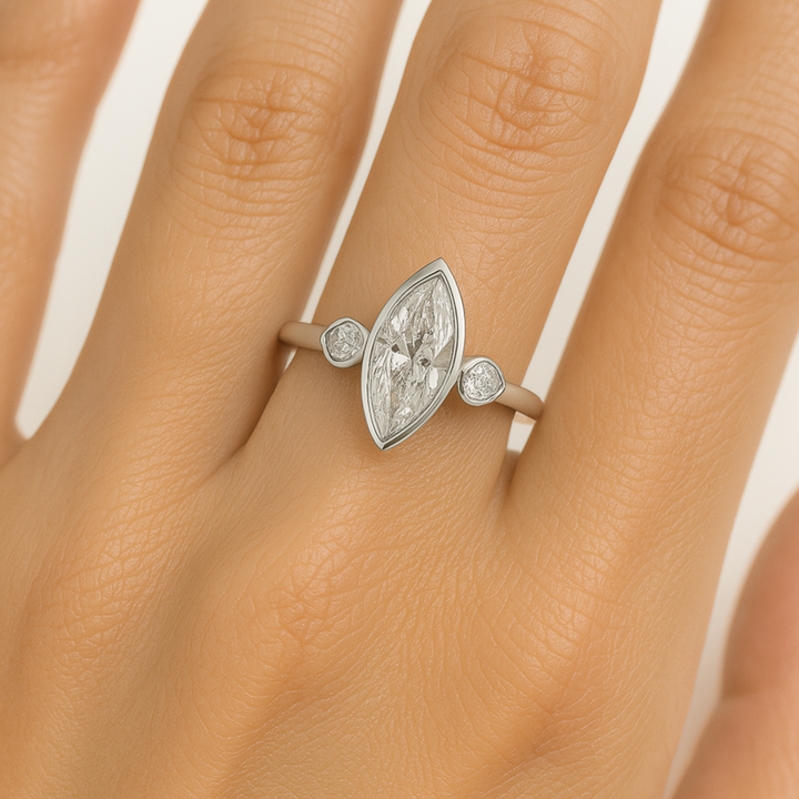 1.5 Carat Marquise Cut Lab Diamond Engagement Ring with Pear Accents on Hand 3 Stone Bezel Set in White Gold | Rare Earth Jewelry