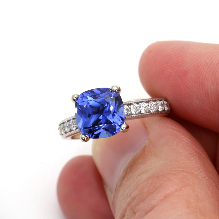 An 8mm Chatham Blue Sapphire Engagement Ring, 3 Carat Cushion Cut Sapphire Ring, Vintage Style Cathedral Solitaire Setting with Diamond Accents and Milgrain in Gold or Platinum | Rare Earth Jewelry