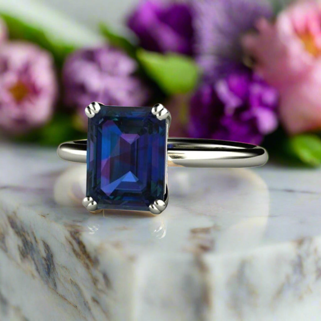 Emerald Cut Alexandrite Engagement Ring, Unique Color Change Gemstone, June Birthstone Ring, Classic Double Prong Solitaire in 14K or 18K Gold and Platinum | Rare Earth Jewelry