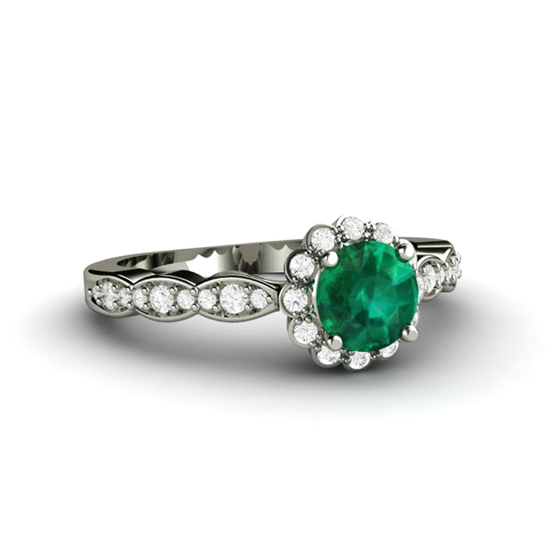 Emerald halo engagement ring with a pretty, feminine style. Unique and affordable lab created emerald ring.