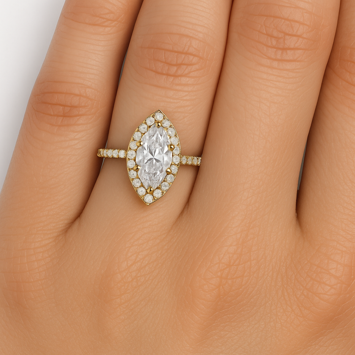Marquise cut lab grown diamond engagement ring with pave set diamond halo close up on the finger  1.5ct diamond on the hand | Rare Earth Jewelry