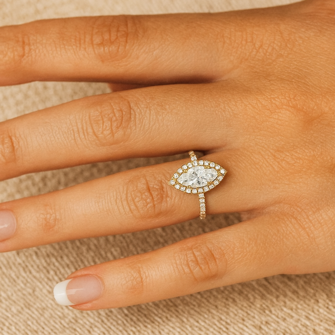 1.5 carat marquise cut lab grown diamond engagement ring on the hand, 6 prong cathedral setting with pave diamond halo | Rare Earth Jewelry