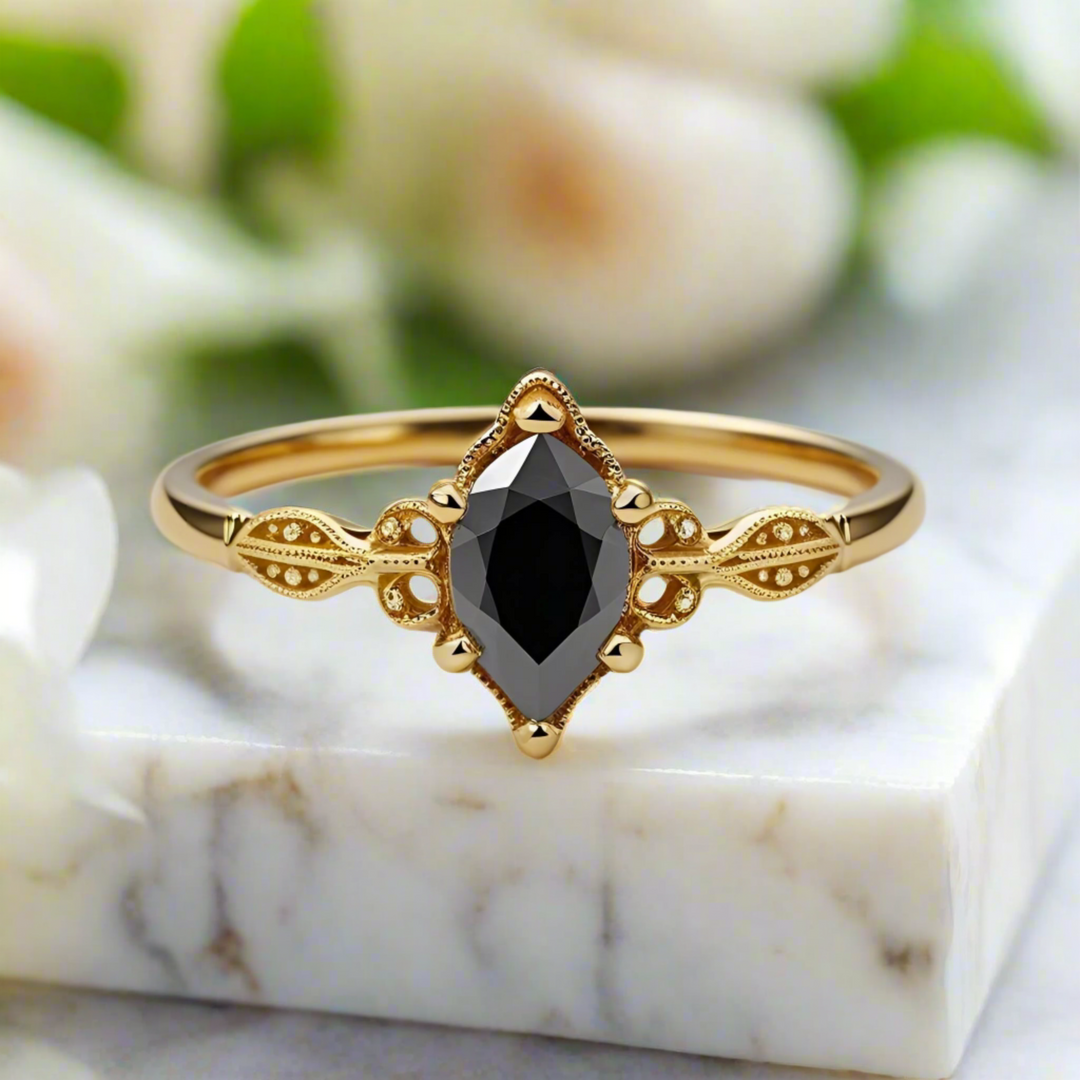 A romantic pear shaped black diamond ring with a feminine vintage design, lace-like openwork, and delicate milgrain edges. Unique Custom Engagement Rings | Rare Earth Jewelry