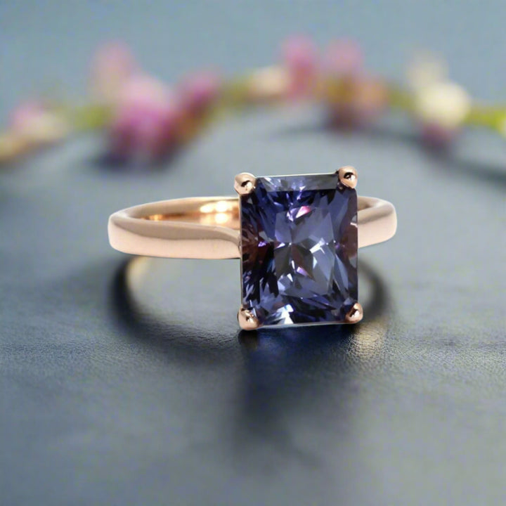 Color change blue sapphire ring, blue sapphire engagement ring, emerald cut sapphire ring in rose gold cathedral solitaire setting | Rare Earth Jewelry
