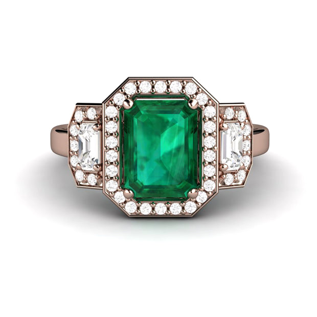 Emerald cut green emerald engagement ring in rose gold 3 stone halo statement ring.