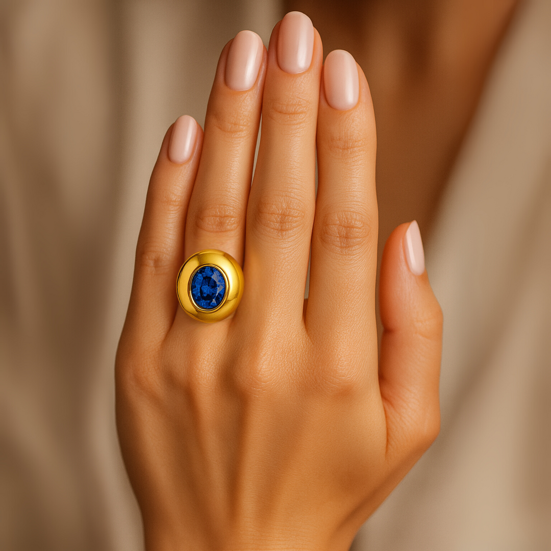 Large Oval Blue Sapphire Dome Ring shown on the Hand, Bezel Set Sapphire Ring,  Modern Statement Ring, Oversized Chunky Cocktail Ring in Gold or Platinum | Rare Earth Jewelry