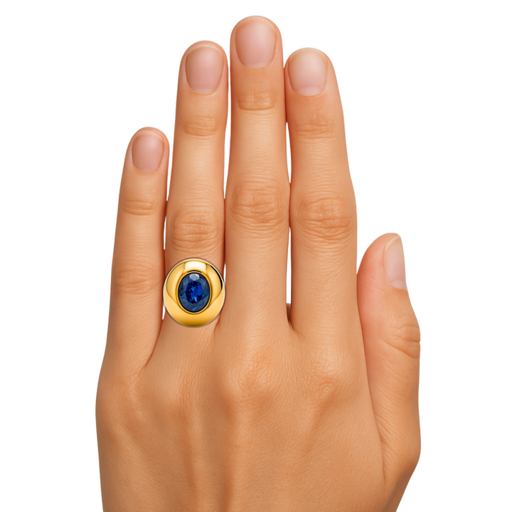 Large Oval Blue Sapphire Dome Ring shown on the Finger, Bezel Set Sapphire Ring,  Modern Statement Ring, Oversized Chunky Cocktail Ring in Gold or Platinum | Rare Earth Jewelry