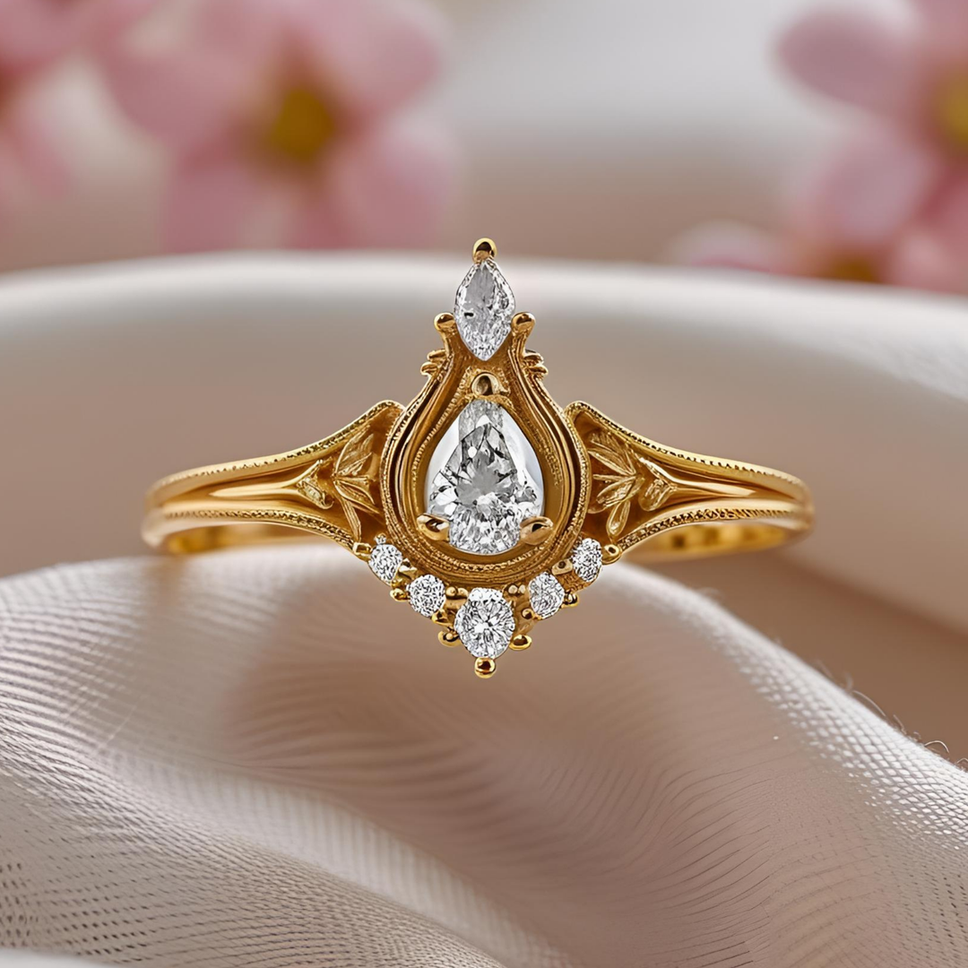 Pear-shaped diamond ring with ornate crown-inspired design, intricate vintage detailing, milgrain edges, and romantic craftsmanship. Unique Custom Engagement Rings | Rare Earth Jewelry