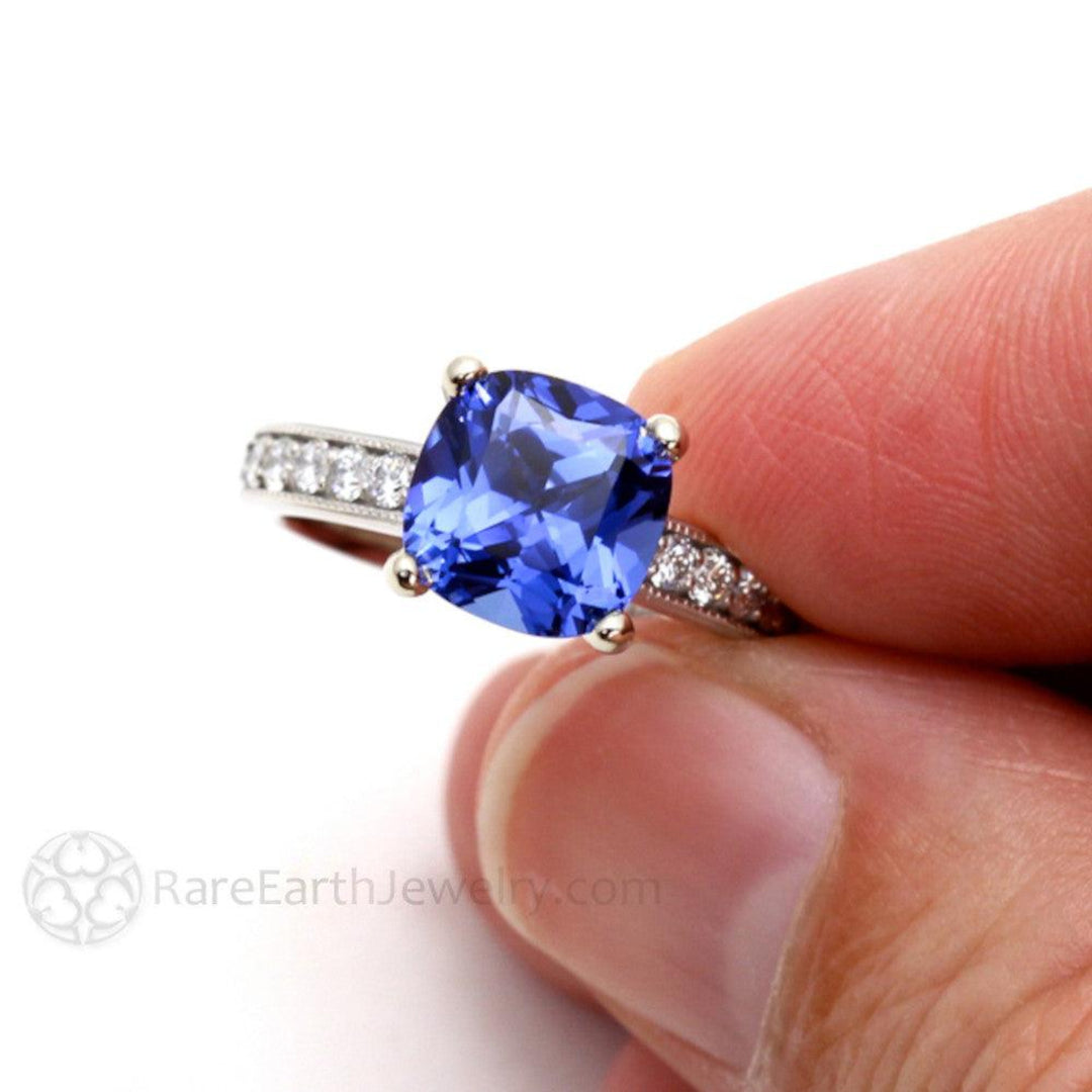Close up of Cushion Cut Blue Sapphire Engagement Ring, 3ct Sapphire Ring with Diamond Accented Band and Milgrain, September Birthstone Gemstone Ring | Rare Earth Jewelry