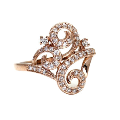 An antique style diamond ring with swirls of gold, pave set diamonds and milgrain beaded edge details with a Georgian or Victorian inspired design.  A unique engagement or right hand ring from Rare Earth Jewelry.