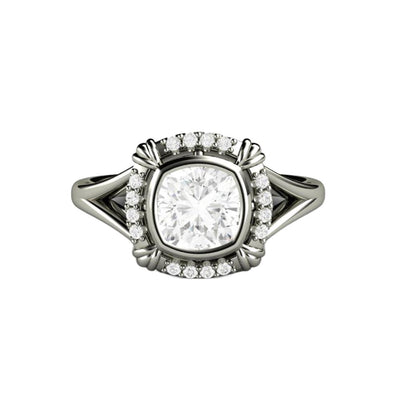 An Antique Style Moissanite Engagement Ring with an Art Deco Design, a cushion cut bezel set Moissanite ring from Rare Earth Jewelry.