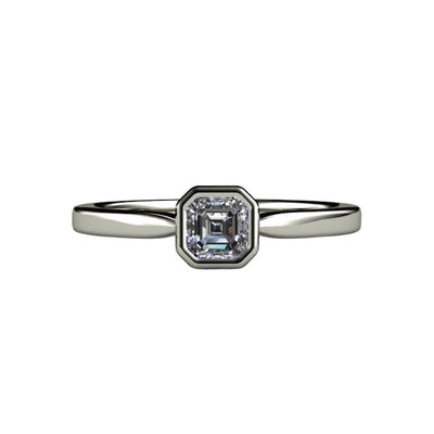 An asscher cut diamond engagement ring with a simple, minimalist style solitaire and a .30ct GIA certified natural diamond from Rare Earth Jewelry.