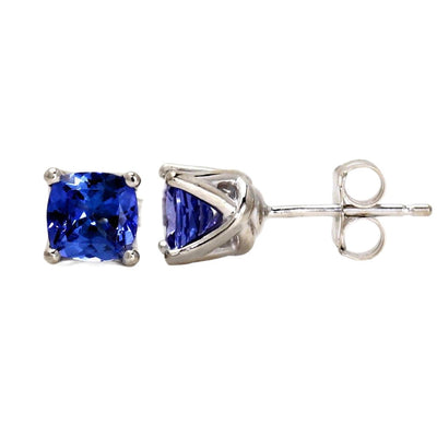 A pair of blue sapphire stud earrings with cushion cut lab grown blue sapphires in 14K Gold woven prong settings. September birthstone earrings from Rare Earth Jewelry.