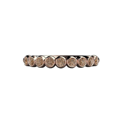 A cognac colored dark brown diamond band in a bezel set round bubble design wedding ring shown in rose gold from Rare Earth Jewelry.