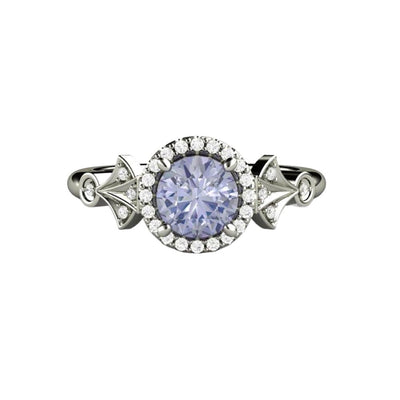A unique vintage inspired purple sapphire ring with a round color-change lavender purple sapphire and diamond halo, in a unique Art Deco style engagement ring design from Rare Earth Jewelry.