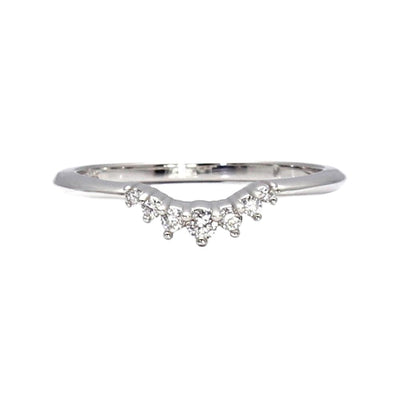 A contoured wedding ring with diamonds around the front that is curved to fit most solitaire engagement rings, available in Gold or Platinum from Rare Earth Jewelry.