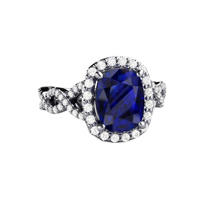 A large rectangular cushion cut Blue Sapphire engagement ring with diamond accents, an infinity design split shank with diamond accents and diamond halo in gold or platinum.