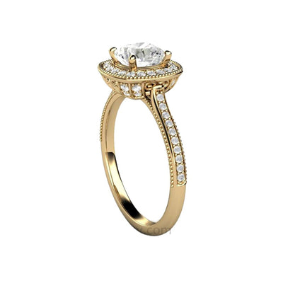 A vintage style Moissanite engagement ring with filigree, a milgrain beaded edge and a diamond halo.  The center stone is a cushion cut Charles & Colvard Forever One Moissanite, an ethical and eco-friendly lab created diamond alternative from Rare Earth Jewelry.