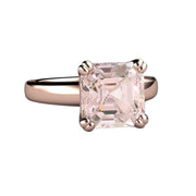 An asscher cut Morganite Engagement ring with a large 3.25ct natural Morganite, a peach pink gemstone in a sophisticated solitaire setting with double prongs, shown in rose gold from Rare Earth Jewelry.