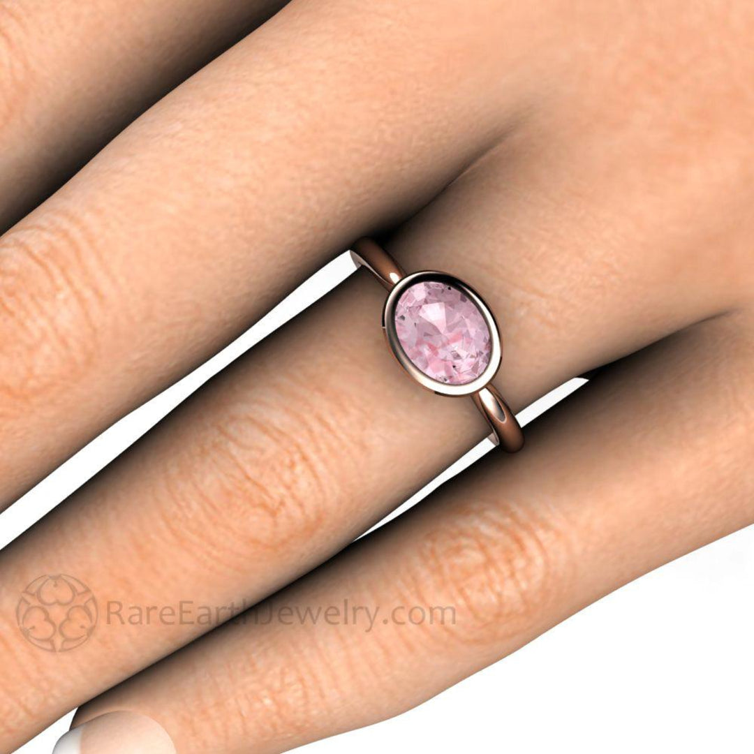 Light Pink Sapphire Engagement Ring, Oval Bezel Set Solitaire, East West Minimalist Design on the Hand | Rare Earth Jewelry