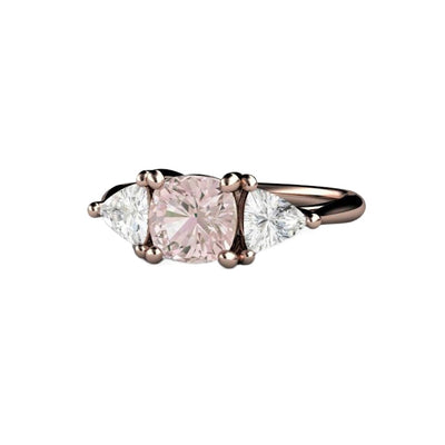 A Light Pink Sapphire Ring Cushion Cut Pink Sapphire Engagement Ring in a 3 Stone Style with Trillions in Gold or Platinum, Shown in Rose Gold from Rare Earth Jewelry.