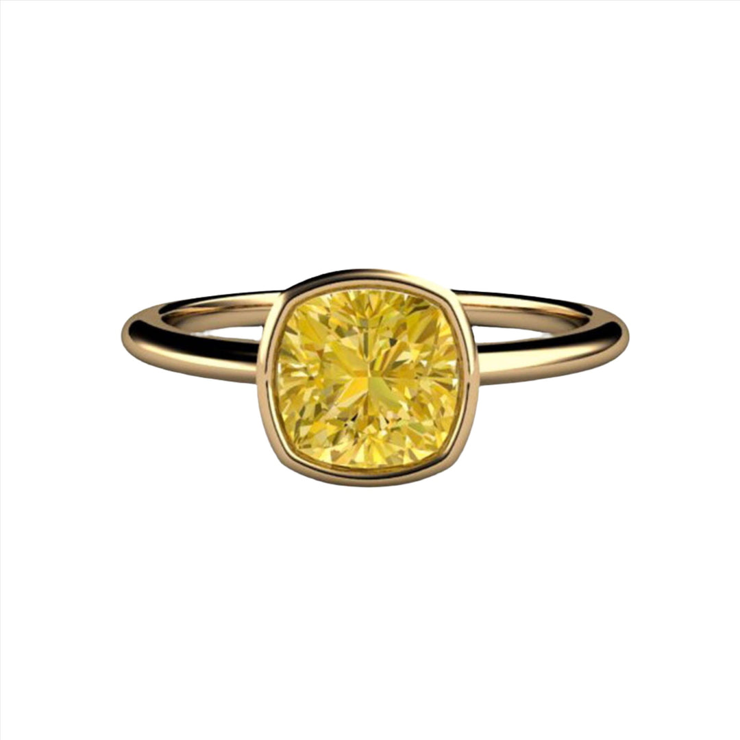 Cushion Cut Yellow Moissanite Engagement Ring, Yellow Moissanite Bezel Set Ring with Thin Band in Gold or Platinum.  Minimalist Solitaire Design from Rare Earth Jewelry