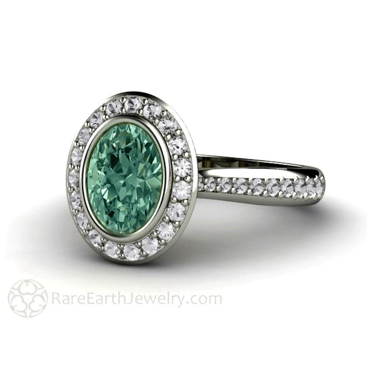 Blue Green Montana Sapphire Engagement Ring | Oval Bezel with Diamond Halo, Rare Earth Jewelry