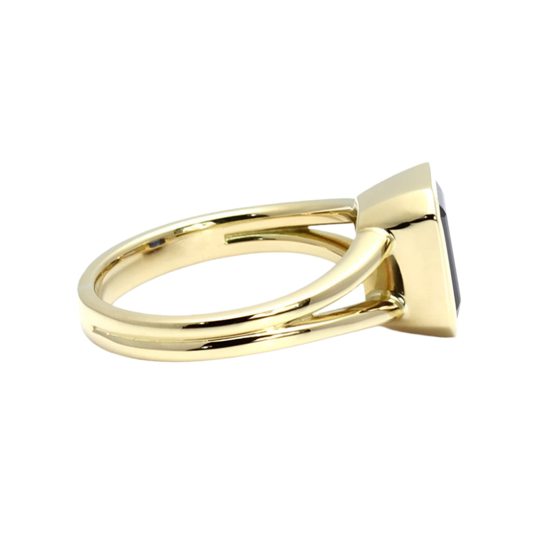 Bezel set sapphire engagement ring showing low profile side view and split shank design in yellow gold | Rare Earth Jewelry