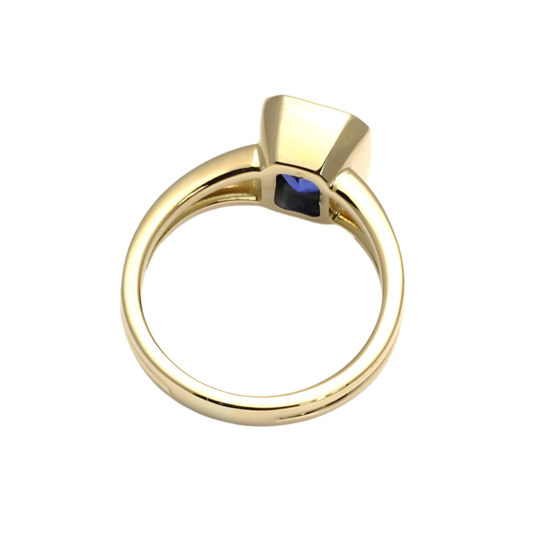 Underside of emerald cut blue sapphire engagement ring, bezel set solitaire with split shank | Rare Earth Jewelry