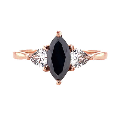A Marquise Cut Black Diamond Engagement Ring with White Sapphire Trillions in Gold or Platinum, shown in Rose Gold from Rare Earth Jewelry