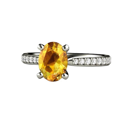 A Yellow Sapphire engagement rings with an Oval cut natural sapphire in a Solitaire design with diamond accents in gold or platinum from Rare Earth Jewelry.