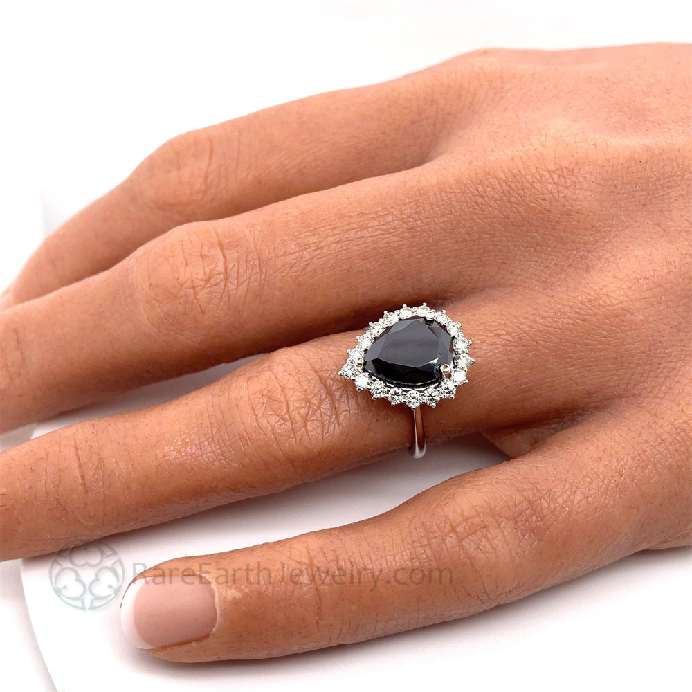 Pear Cut Black Moissanite Engagement Ring shown on the Han, Black Gemstone Cocktail Ring | Rare Earth Jewelry