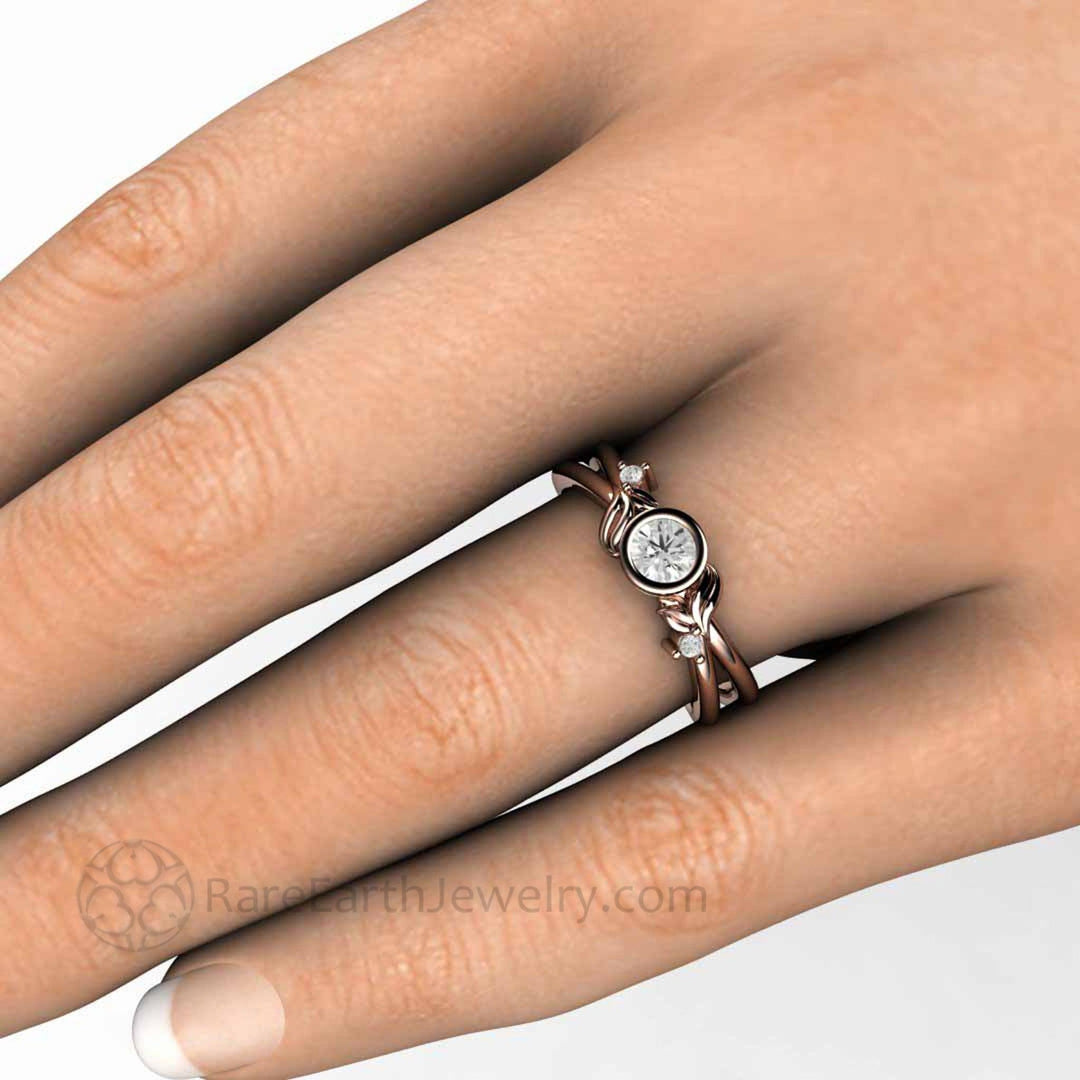 Round Bezel Set Diamond Engagement Ring with Nature Inspired Flower and Leaf Design, Shown on the Hand in Rose Gold | Rare Earth Jewelry