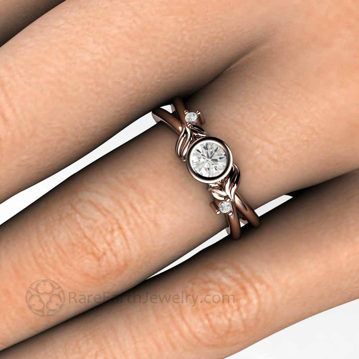 Round Bezel Set Diamond Engagement Ring with Nature Inspired Flower and Leaf Design, Close Up on the Finger | Rare Earth Jewelry