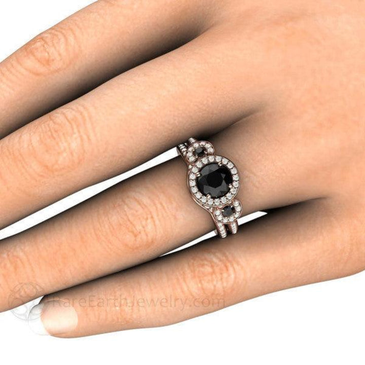 Round Black Diamond Engagement Ring and Matching Wedding Band on the Hand,  3 Stone Diamond Halo Bridal Set | Rare Earth Jewelry