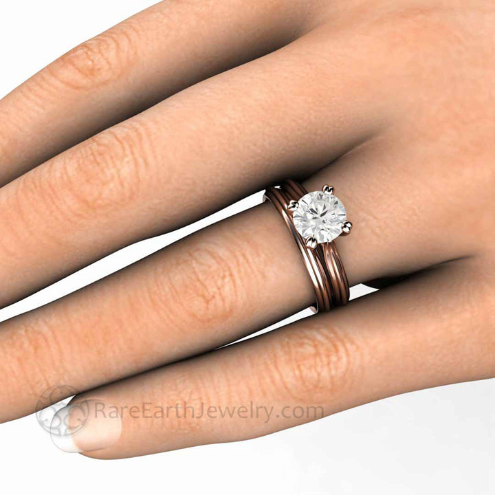1.5 Carat Round Moissanite Solitaire Engagement Ring and Wedding Ring on the Hand