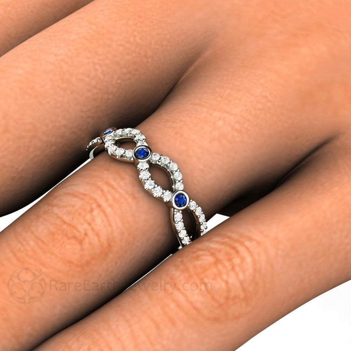 Close up of Sapphire and Diamond Infinity Band on the Finger |  Rare Earth Jewelry