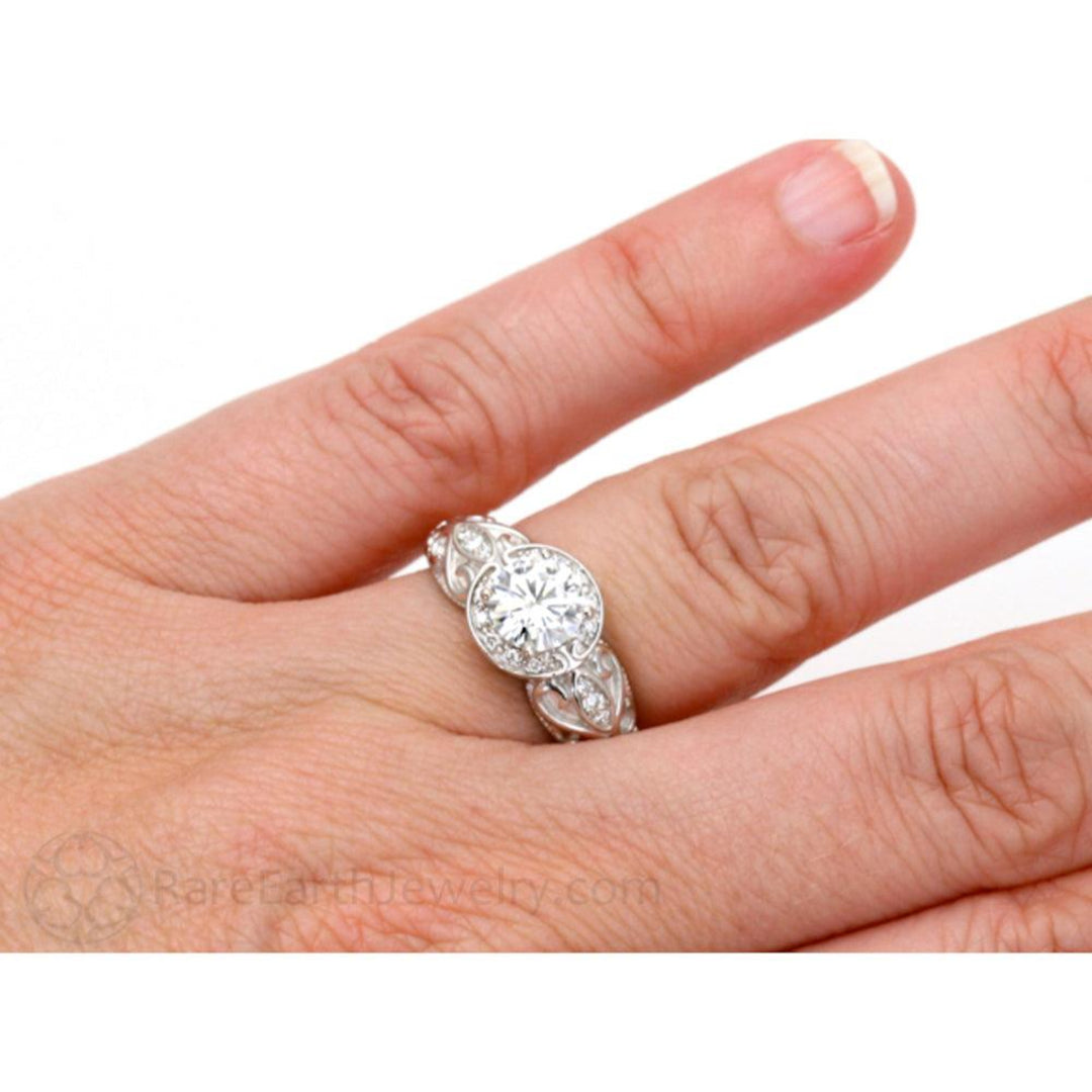 Vintage Style Moissanite Engagement Ring on the Hand, Round Lab Created Diamond Alternative Engagement Ring, Antique Moissanite Ring 14K or 18K Gold and Platinum | Rare Earth Jewelry