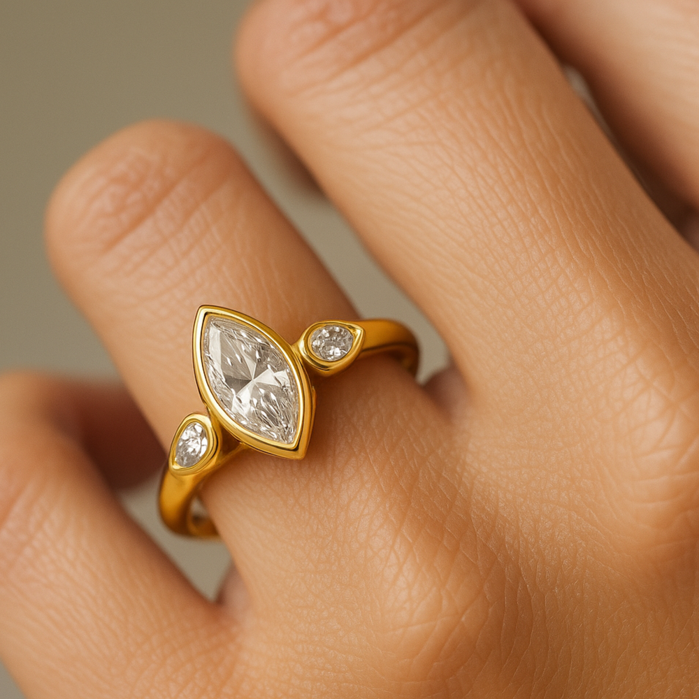 1.5 Carat Marquise Cut Lab Diamond Engagement Ring with Pear Accents on Hand, 3 Stone Bezel Setting in Yellow Gold, IGI Certified | Rare Earth Jewelry