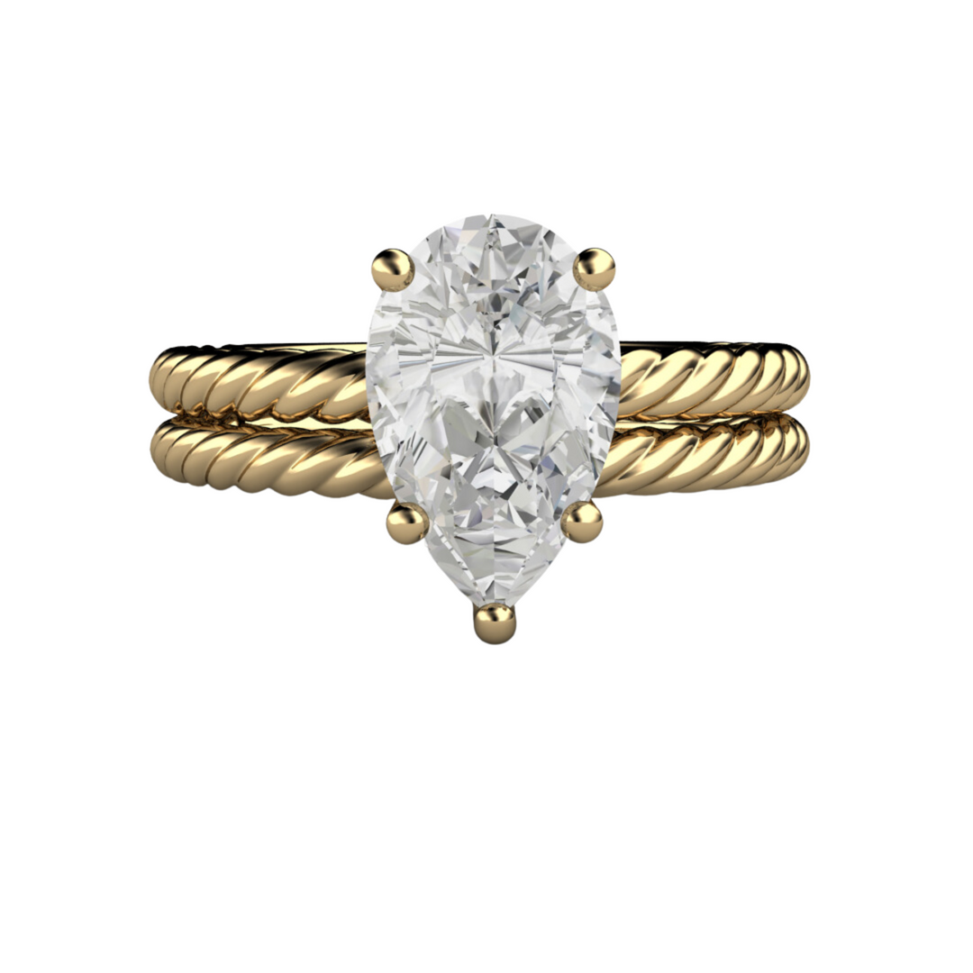 Pear cut engagement ring in 18K Yellow Gold solitaire setting with a twisted band bridal set. 