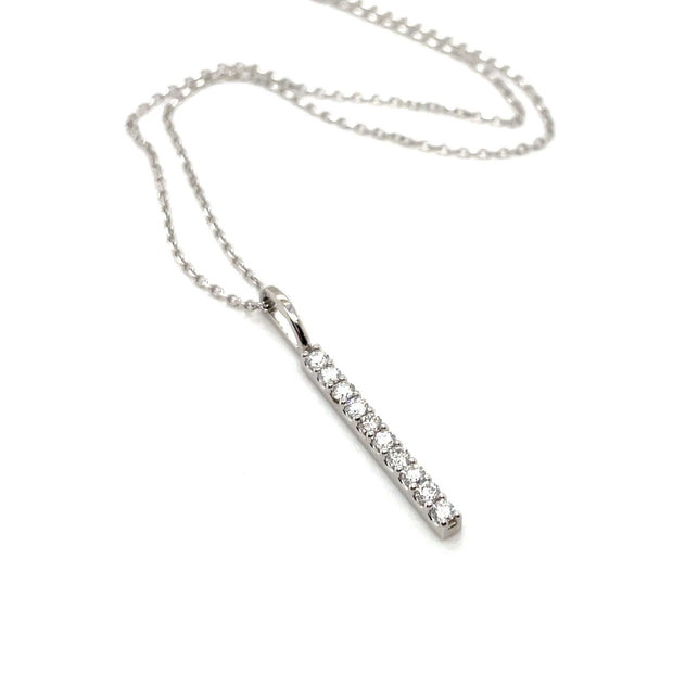 10 stone diamond bar necklace with a vertical line bar style pendant in white gold.