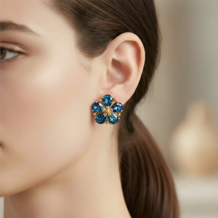 14K Gold London Blue Topaz Flower Earrings, December Birthstone Floral Earrings shown on the Ear | Rare Earth Jewelry
