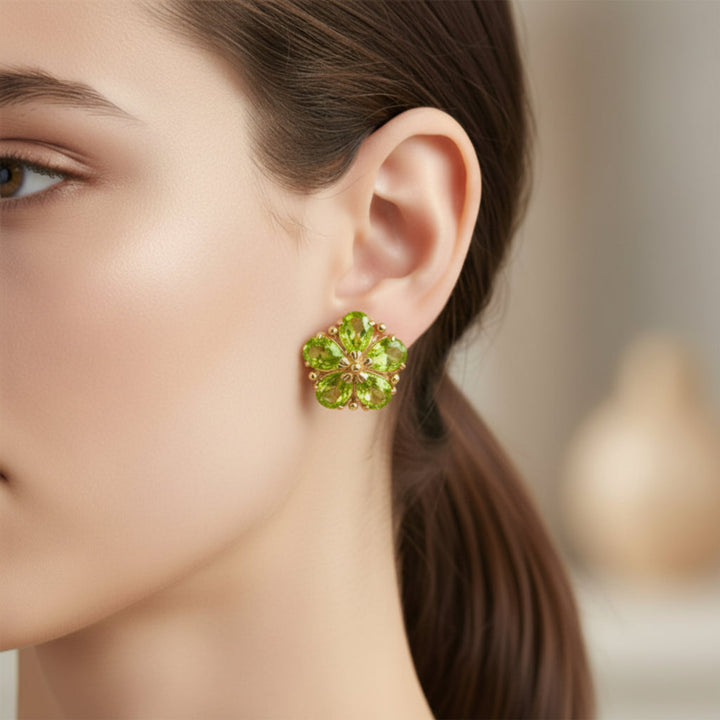 14K Gold Peridot Flower Earrings Shown on the Ear, August Birthstone Earrings with Natural Peridot | Rare Earth Jewelry