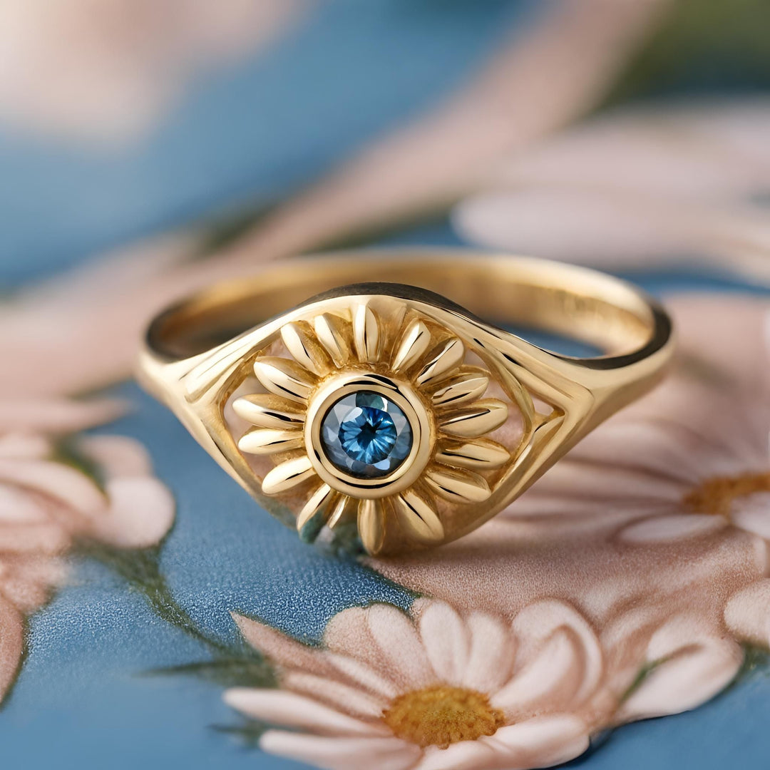 A blue sapphire evil eye ring in 14K Gold unique talisman from Rare Earth Jewelry.