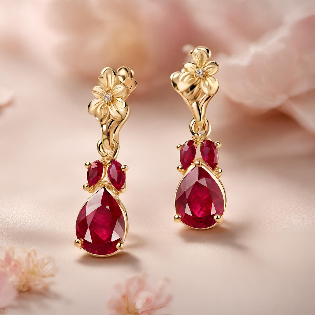 14K Gold Ruby dangle earrings, pear cut Ruby earrings drops with diamond studded flowers on top from Rare Earth Jewelry.