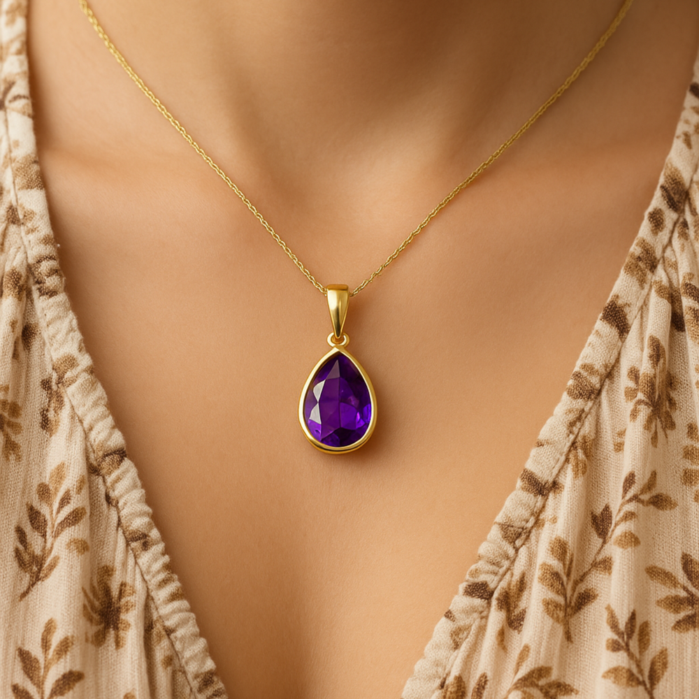 Pear amethyst necklace worn on model in 14K yellow gold, everyday purple gemstone pendant, modern minimalist jewelry | Rare Earth Jewelry