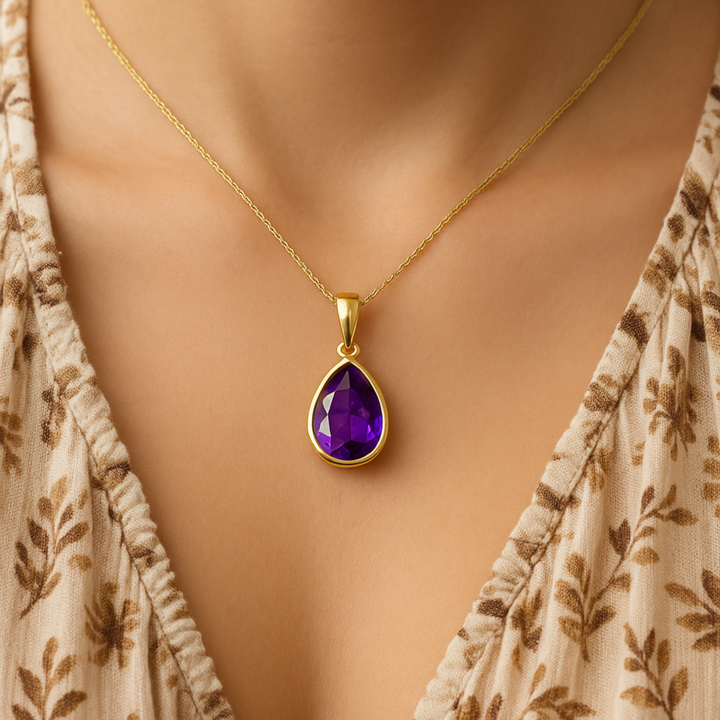 Pear amethyst necklace worn on model in 14K yellow gold, everyday purple gemstone pendant, modern minimalist jewelry | Rare Earth Jewelry