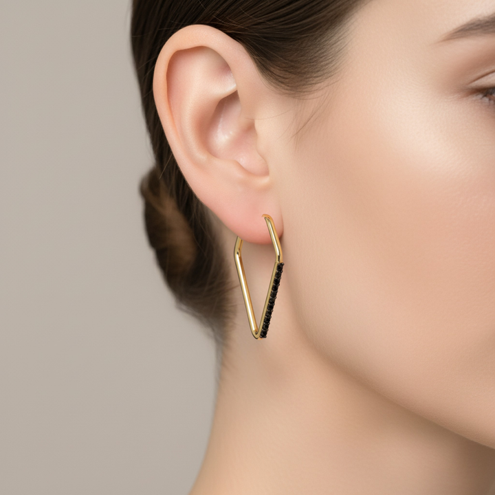 14K geometric black diamond hoop earrings in 14K yellow gold shown on model, modern huggie style earrings, 30mm hoops earrings | Rare Earth Jewelry