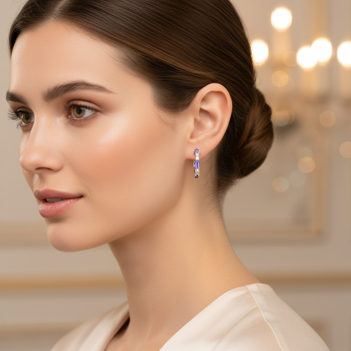 14K Natural Tanzanite and Diamond Hoop Earrings shown on a Model, Baguette Hoops with Alternating Tanzanite baguettes and round Diamonds, December Birthstone Earrings with light purple gemstones. | Rare Earth Jewelry